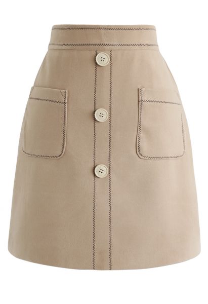 Minifalda con botones y bolsillos en contraste en tostado